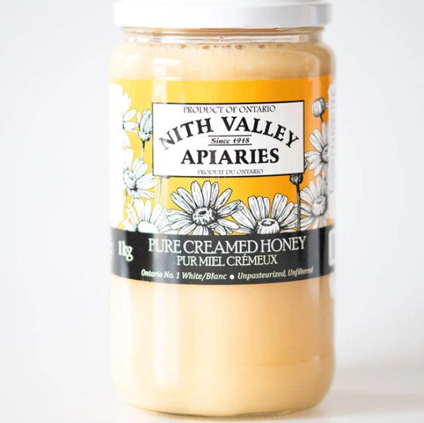 Jar of Nith Valley Apiaries pure creamed honey on a white background