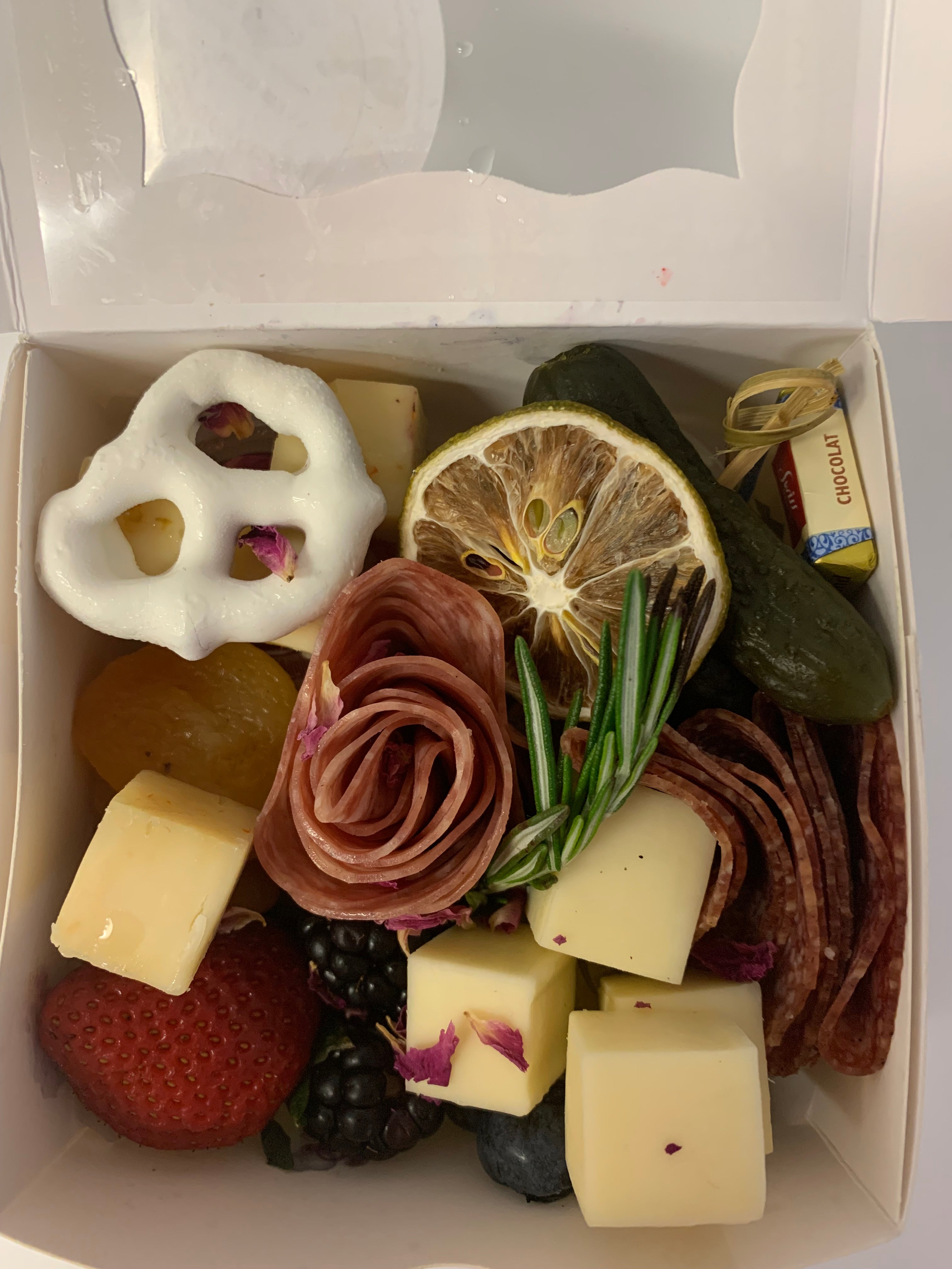 Snack Size Charcuterie box with cheese, meats, fresh fruit and chocolate