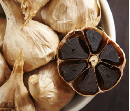Black garlic bulbs - black garlic flavoured olive oil