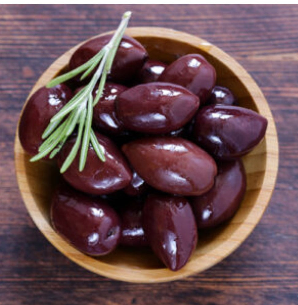 Wooden bowl filled with Greek Kalmata Olives and a fresh sprig of rosemary